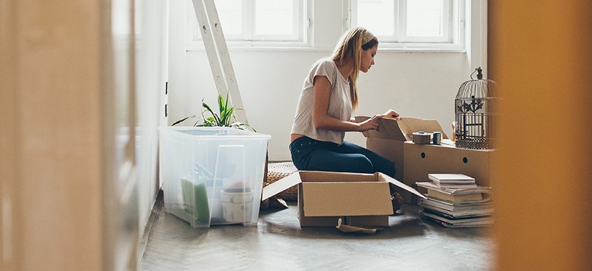 woman packing items for move